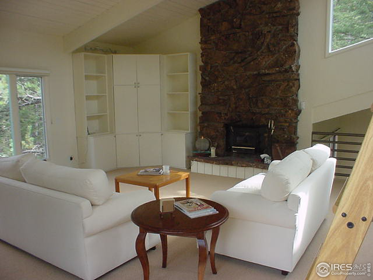 60 Spring Lane Boulder, CO 80302 - Photo 4 of 5 a living room with furniture and a fireplace