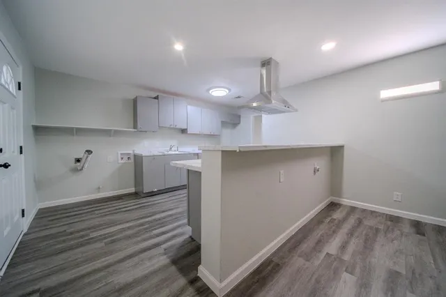 a kitchen with a sink stainless steel appliances and cabinets
