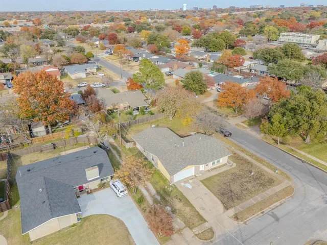 an aerial view of residential houses with outdoor space