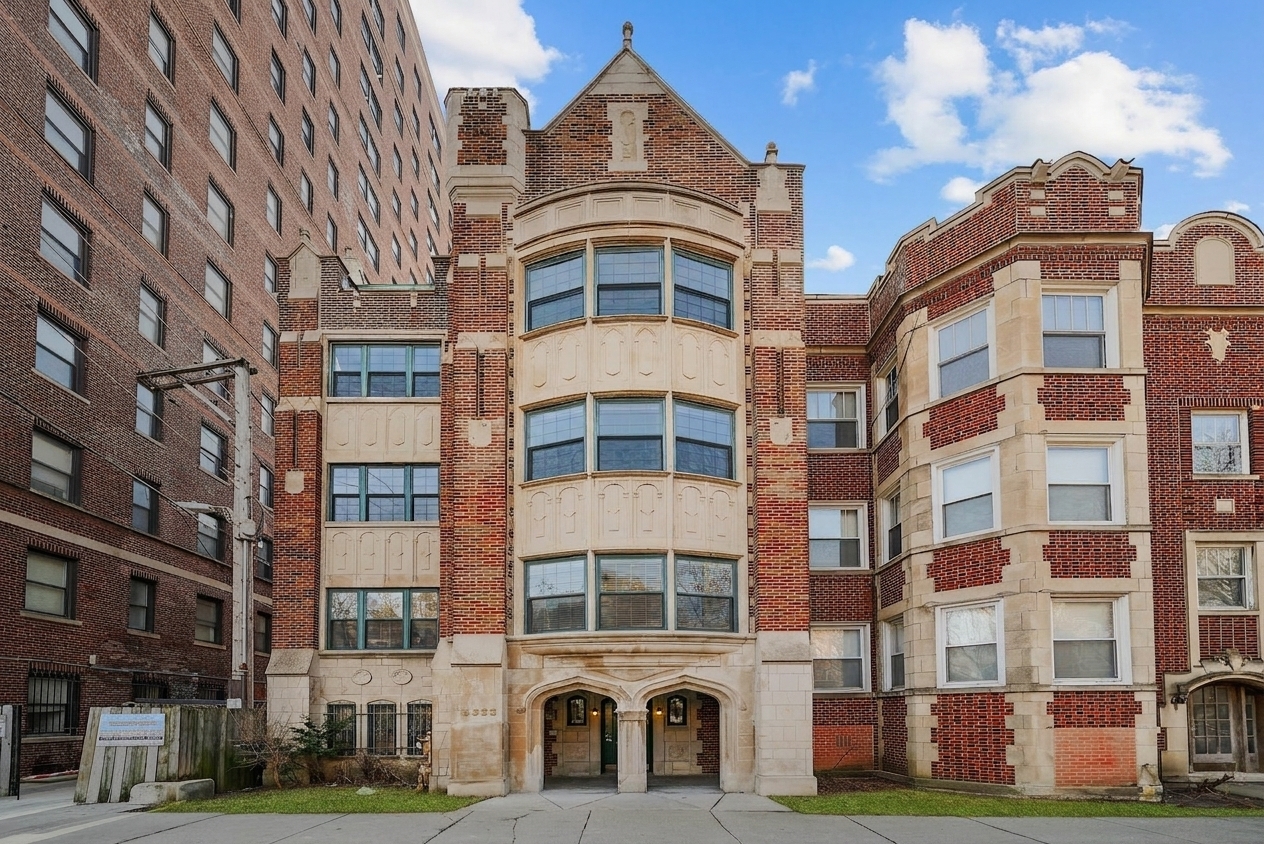 2363 East 70th Street, Unit 1 Chicago, IL 60649 - Photo 1 of 26 a front view of a building with lot of windows