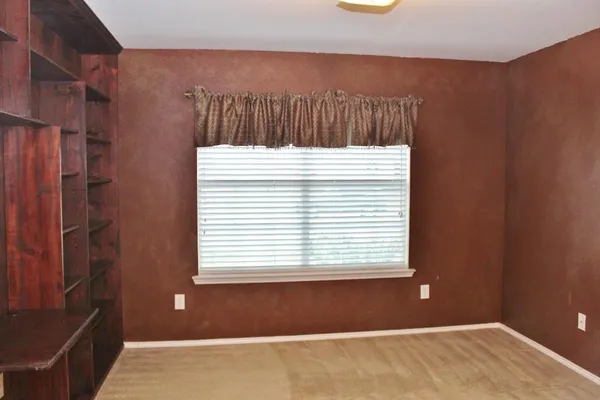 a view of a closet area with empty racks
