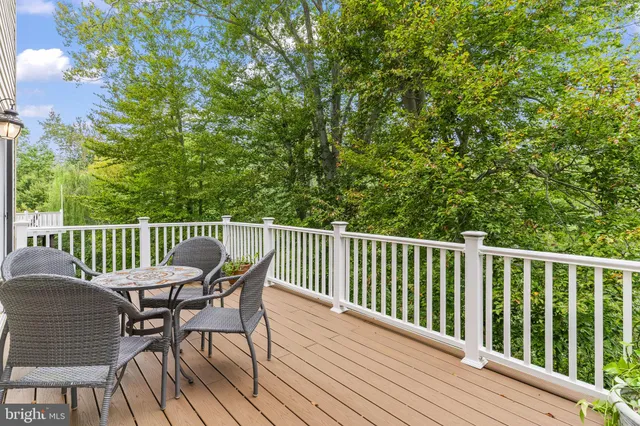 a view of a deck with furniture and wooden floor