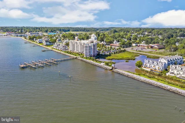 a front view of a residential apartment building with a yard