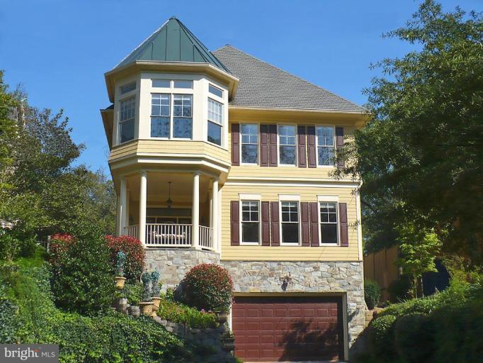 4931 MacArthur Boulevard Northwest Washington, DC 20007 - Photo 1 of 1 a front view of a house with a yard