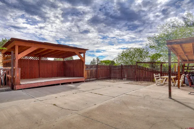 a view of basketball place with wooden fence