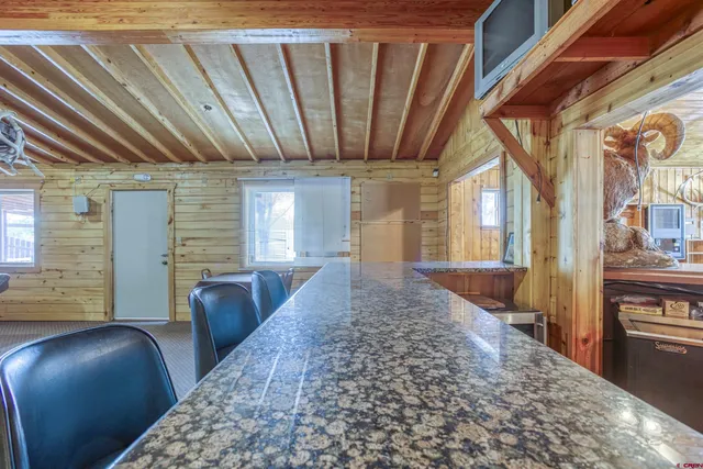 a kitchen with stainless steel appliances granite countertop a sink and a counter space