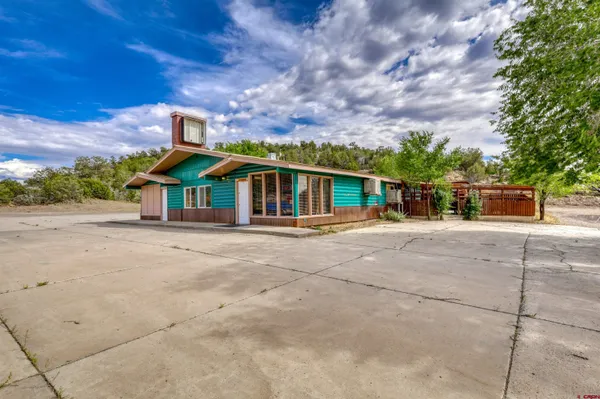 a view of a livingroom with furniture window and wooden floor