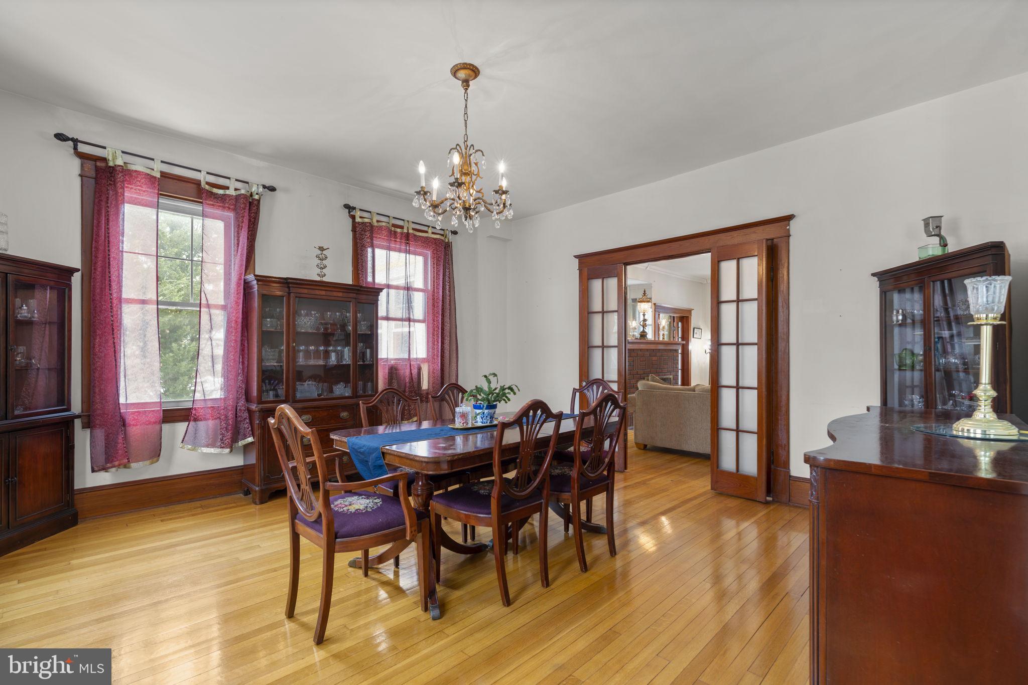 6100 Frederick Road Catonsville, MD 21228 - Photo 13 of 61 a view of a dining room with furniture window and wooden floor