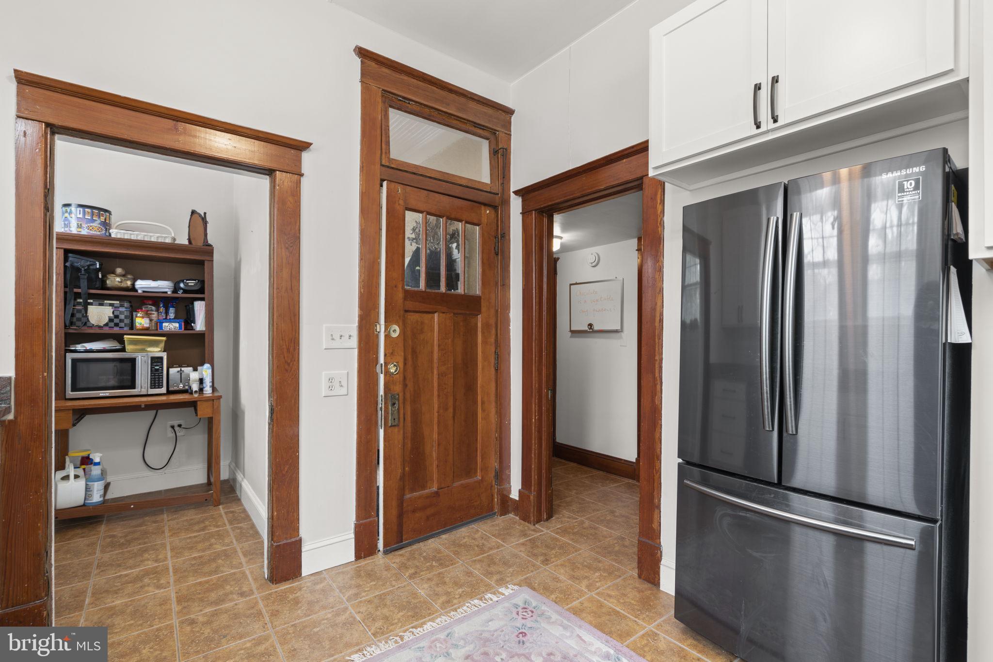 6100 Frederick Road Catonsville, MD 21228 - Photo 19 of 61 a view of kitchen with stainless steel appliances granite countertop cabinets and a counter top space