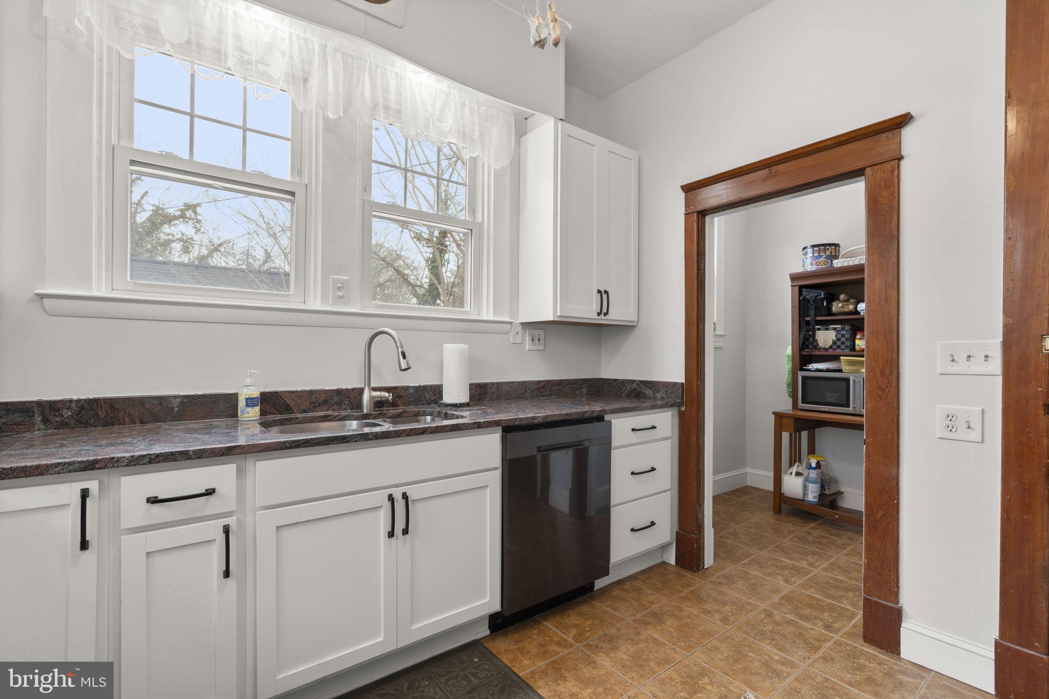 6100 Frederick Road Catonsville, MD 21228 - Photo 20 of 61 a kitchen with stainless steel appliances granite countertop a sink and cabinets