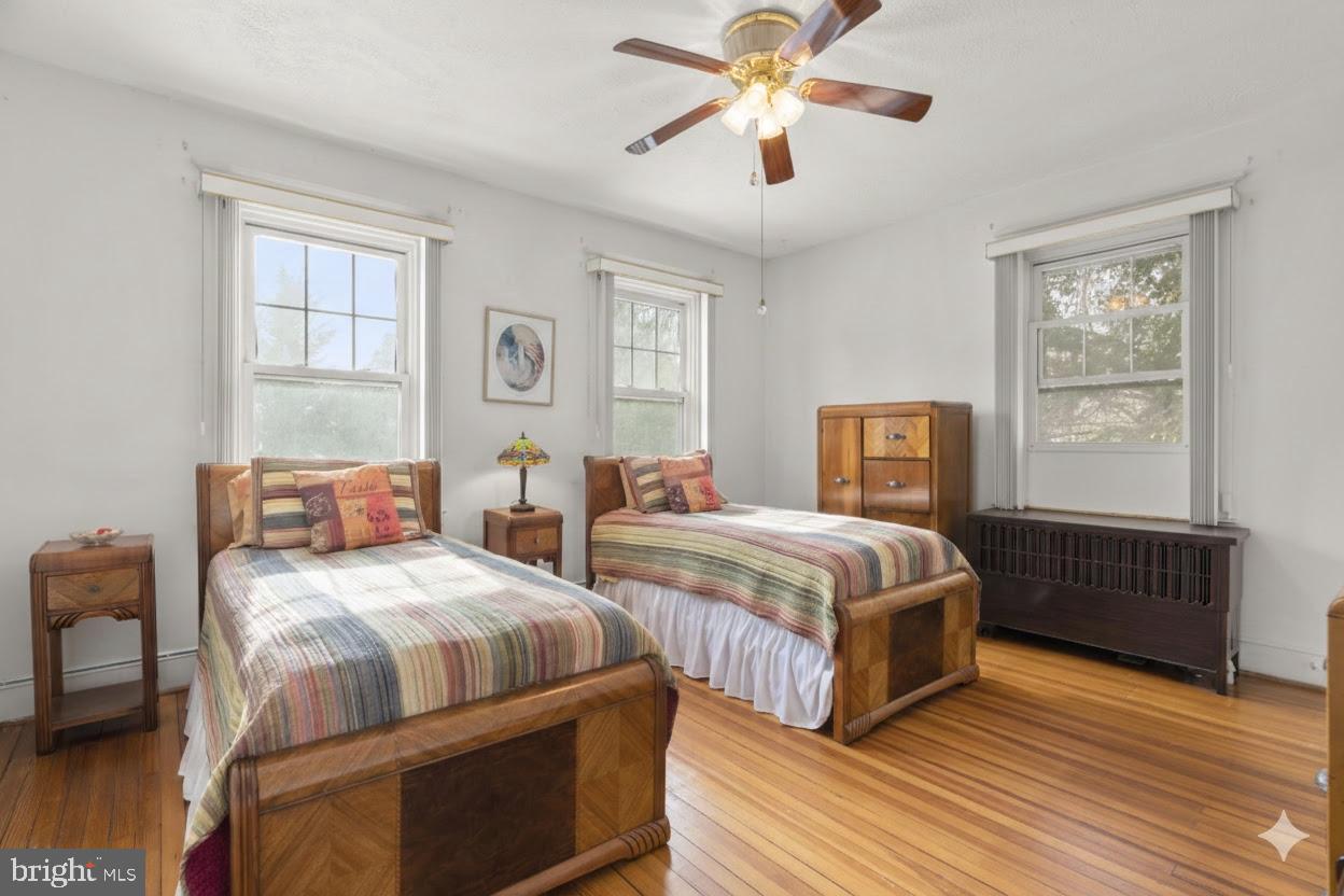 6100 Frederick Road Catonsville, MD 21228 - Photo 26 of 61 a bedroom with two beds and a window