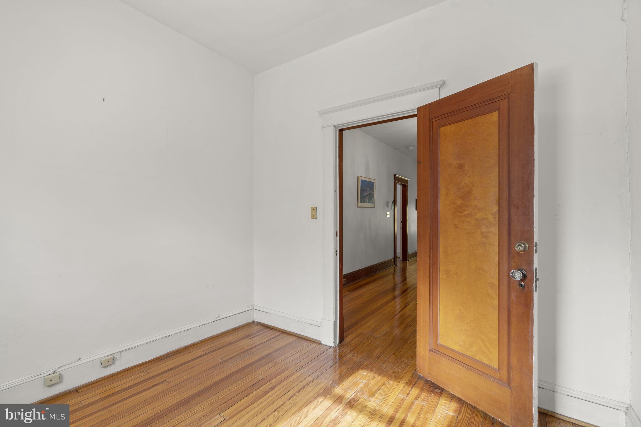 6100 Frederick Road Catonsville, MD 21228 - Photo 29 of 61 a view of a hallway with wooden floor