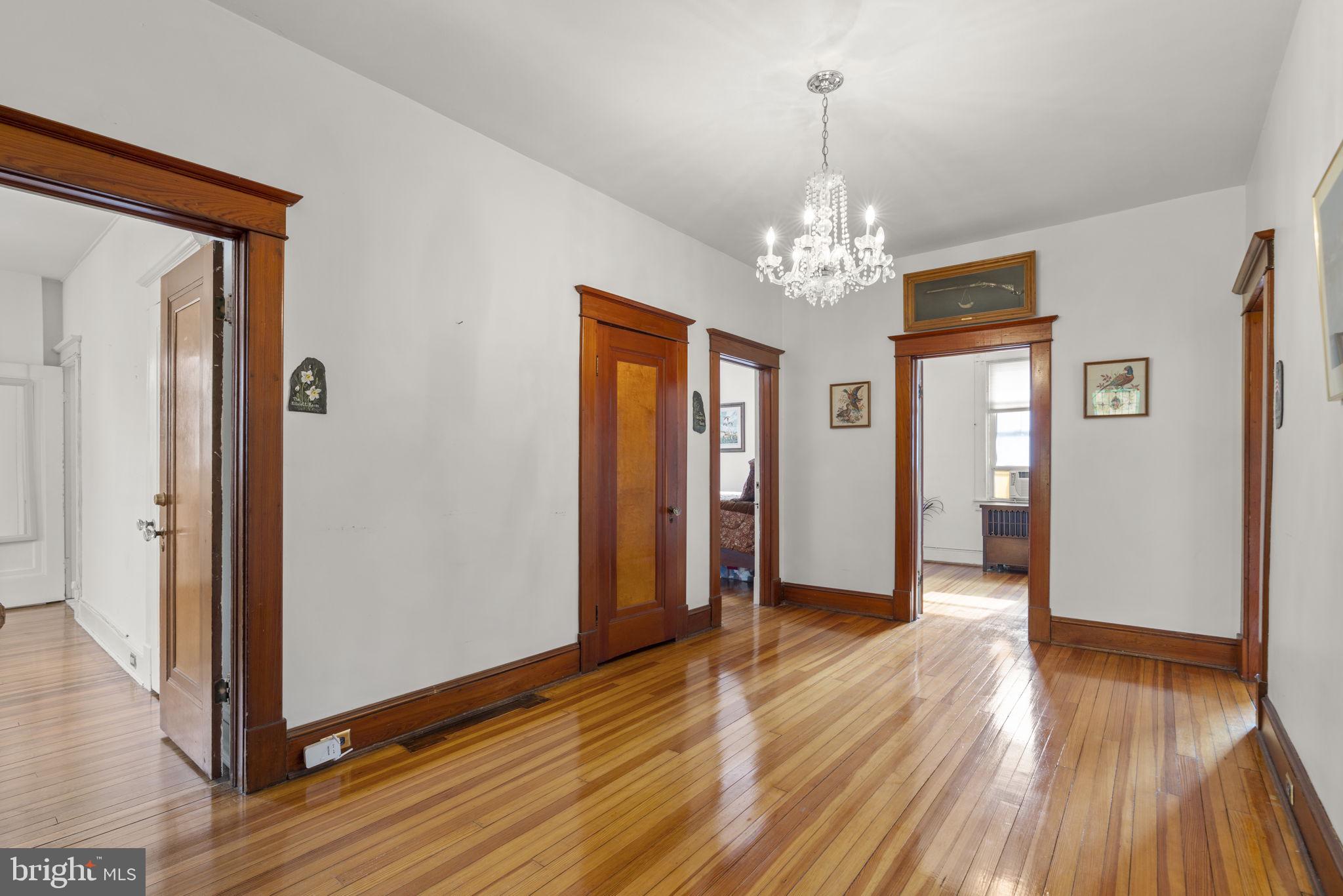 6100 Frederick Road Catonsville, MD 21228 - Photo 30 of 61 wooden floor in an empty room with a window