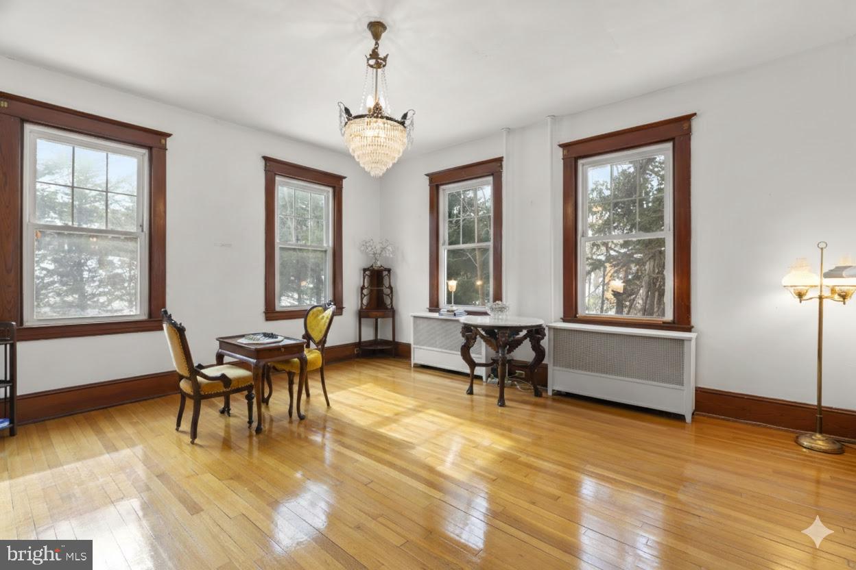 6100 Frederick Road Catonsville, MD 21228 - Photo 4 of 61 a view of a dining room with furniture window and wooden floor