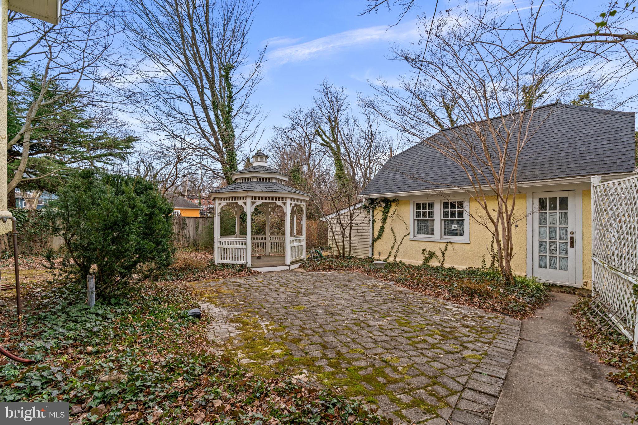 6100 Frederick Road Catonsville, MD 21228 - Photo 47 of 61 a front view of a house with a yard