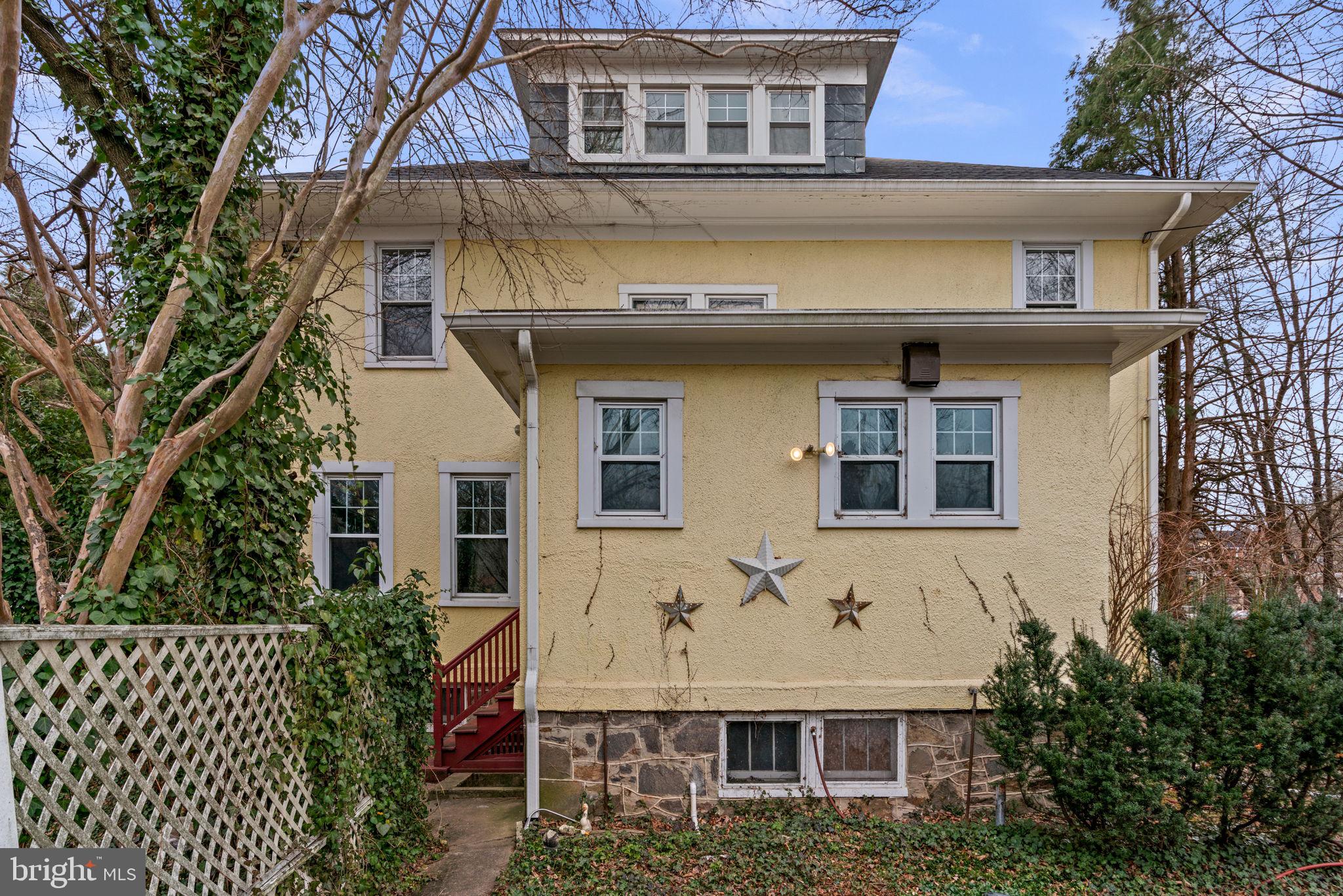 6100 Frederick Road Catonsville, MD 21228 - Photo 50 of 61 a front view of a house with a garden