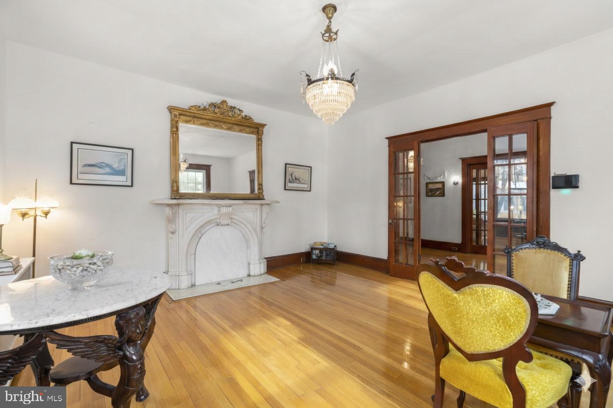 6100 Frederick Road Catonsville, MD 21228 - Photo 5 of 61 a bedroom with bed and wooden floor