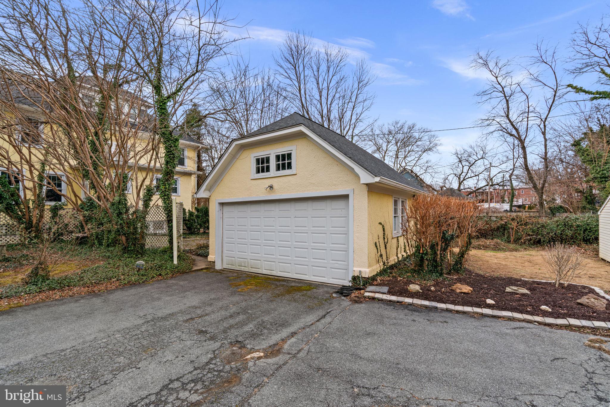 6100 Frederick Road Catonsville, MD 21228 - Photo 55 of 61 a front view of a house with a yard and garage