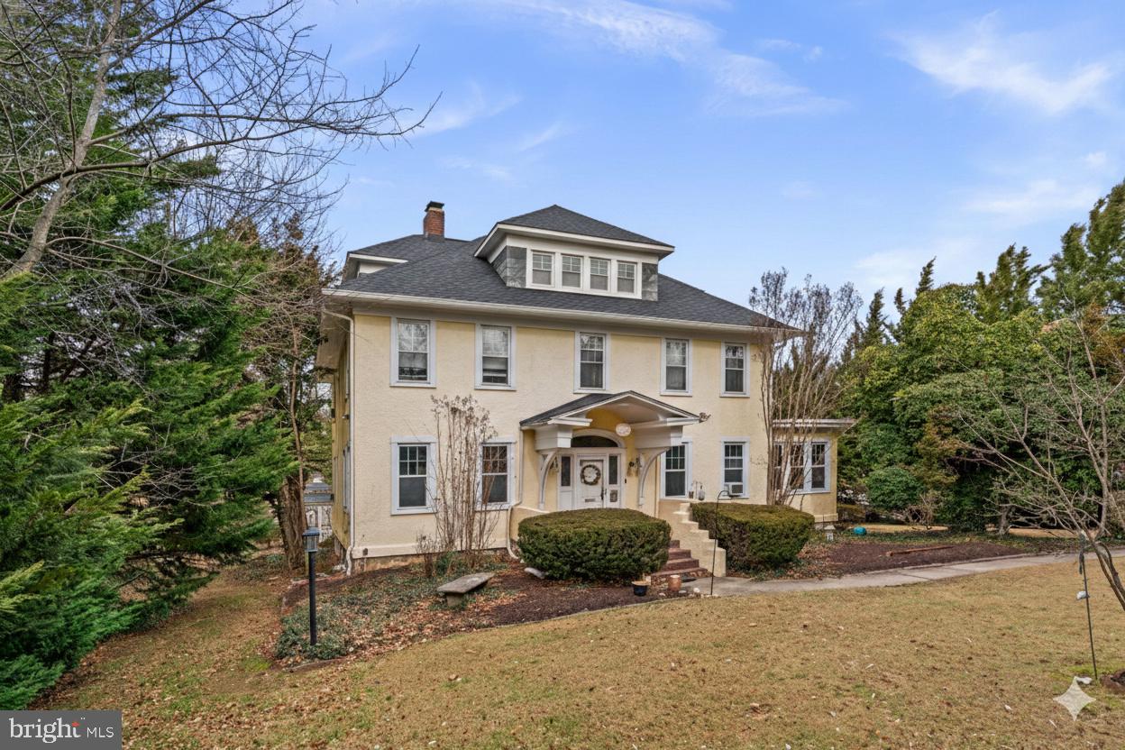 6100 Frederick Road Catonsville, MD 21228 - Photo 56 of 61 a front view of a house with a yard