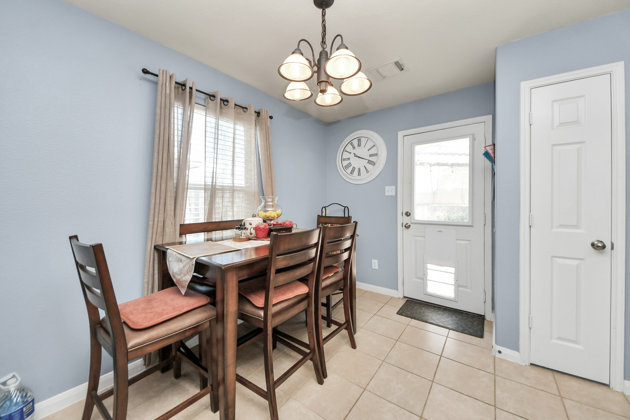 28961 San Bernard River Loop Spring, TX 77386 - Photo 15 of 36 a dining room with wooden floor a chandelier a wooden table and chairs