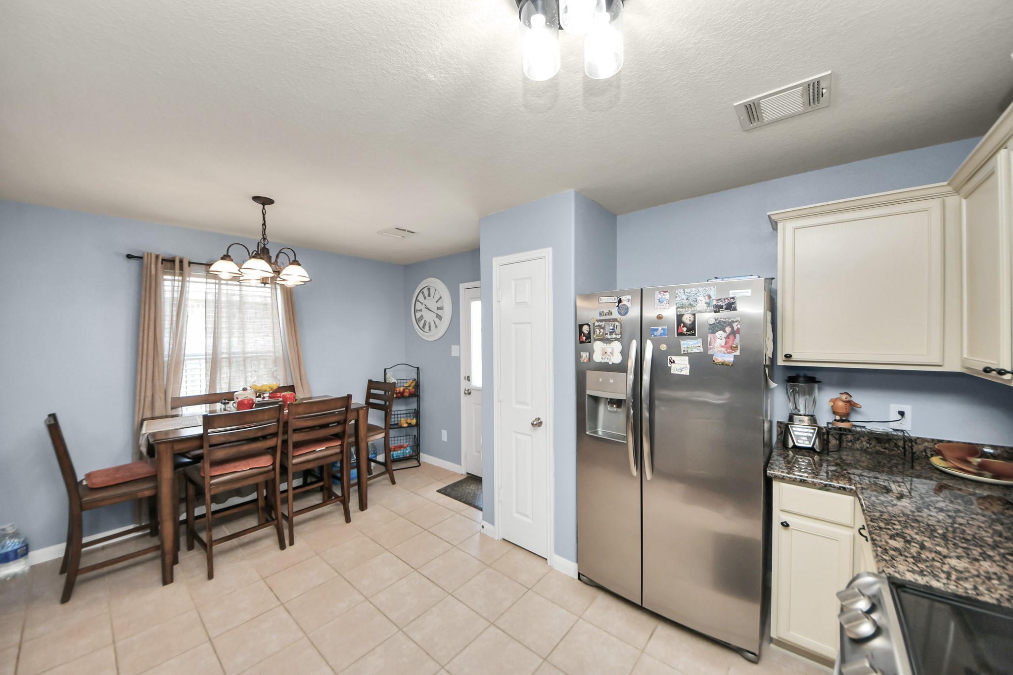 28961 San Bernard River Loop Spring, TX 77386 - Photo 19 of 36 a kitchen with stainless steel appliances granite countertop a refrigerator and a stove top oven
