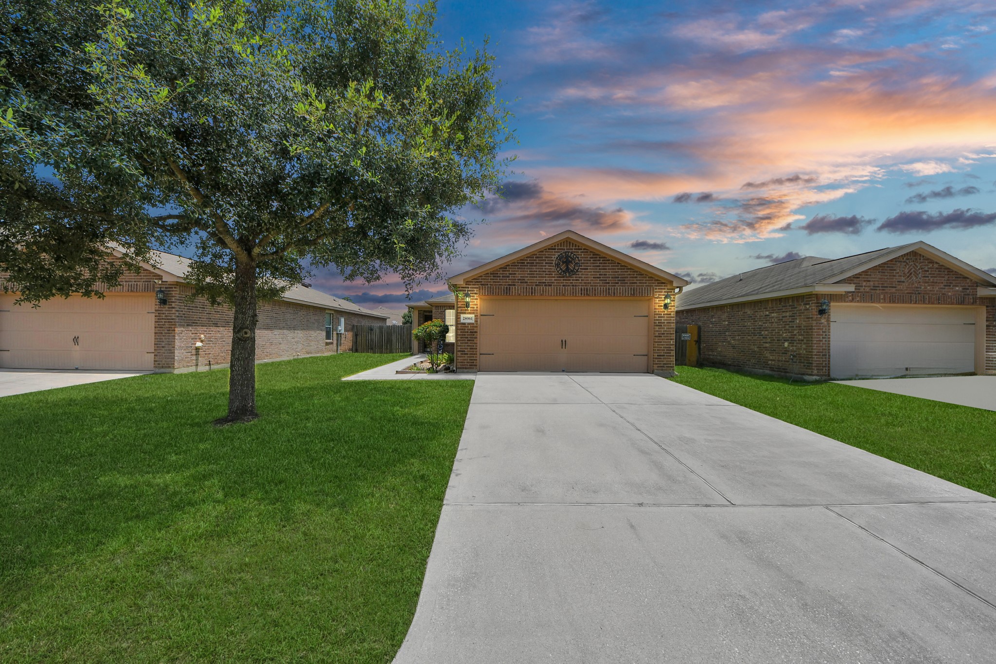 28961 San Bernard River Loop Spring, TX 77386 - Photo 2 of 36 a front view of a house with a yard and garage