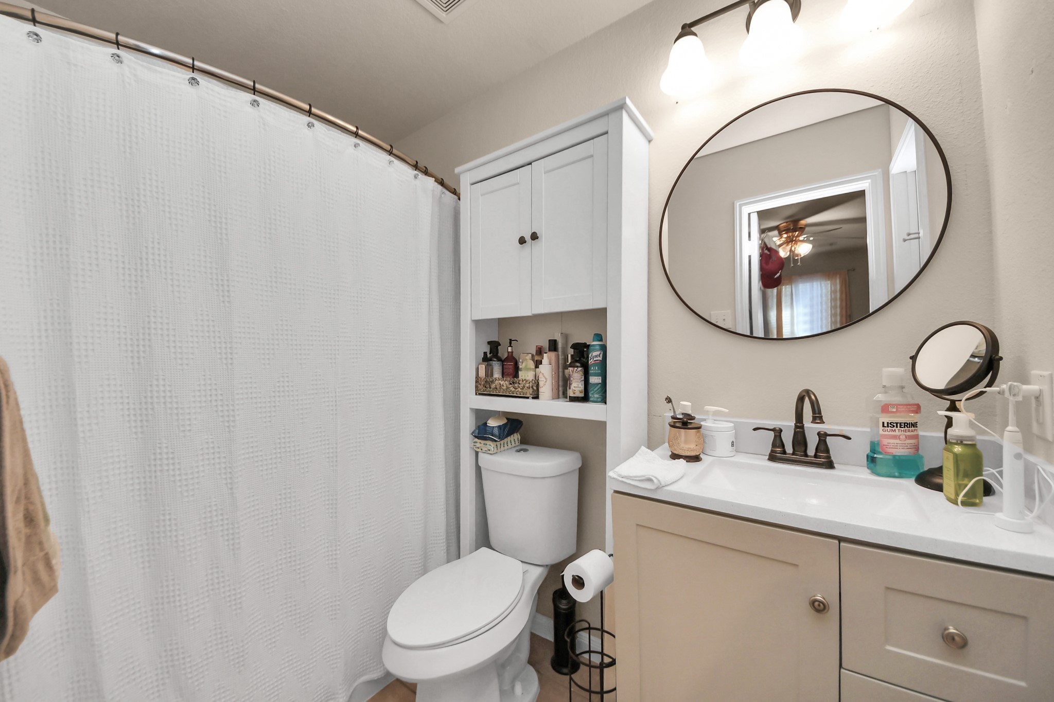 28961 San Bernard River Loop Spring, TX 77386 - Photo 23 of 36 a bathroom with a toilet a sink and a mirror