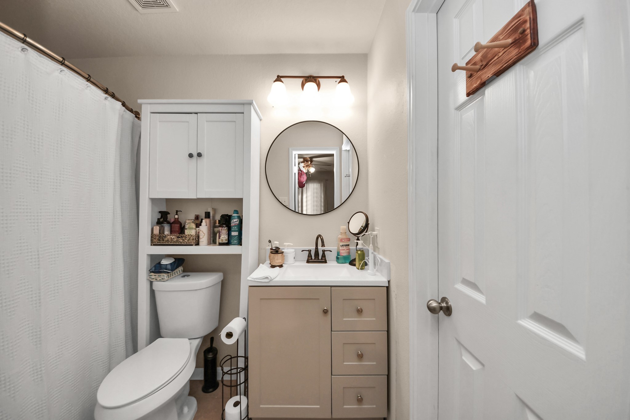 28961 San Bernard River Loop Spring, TX 77386 - Photo 24 of 36 a bathroom with a toilet sink and mirror
