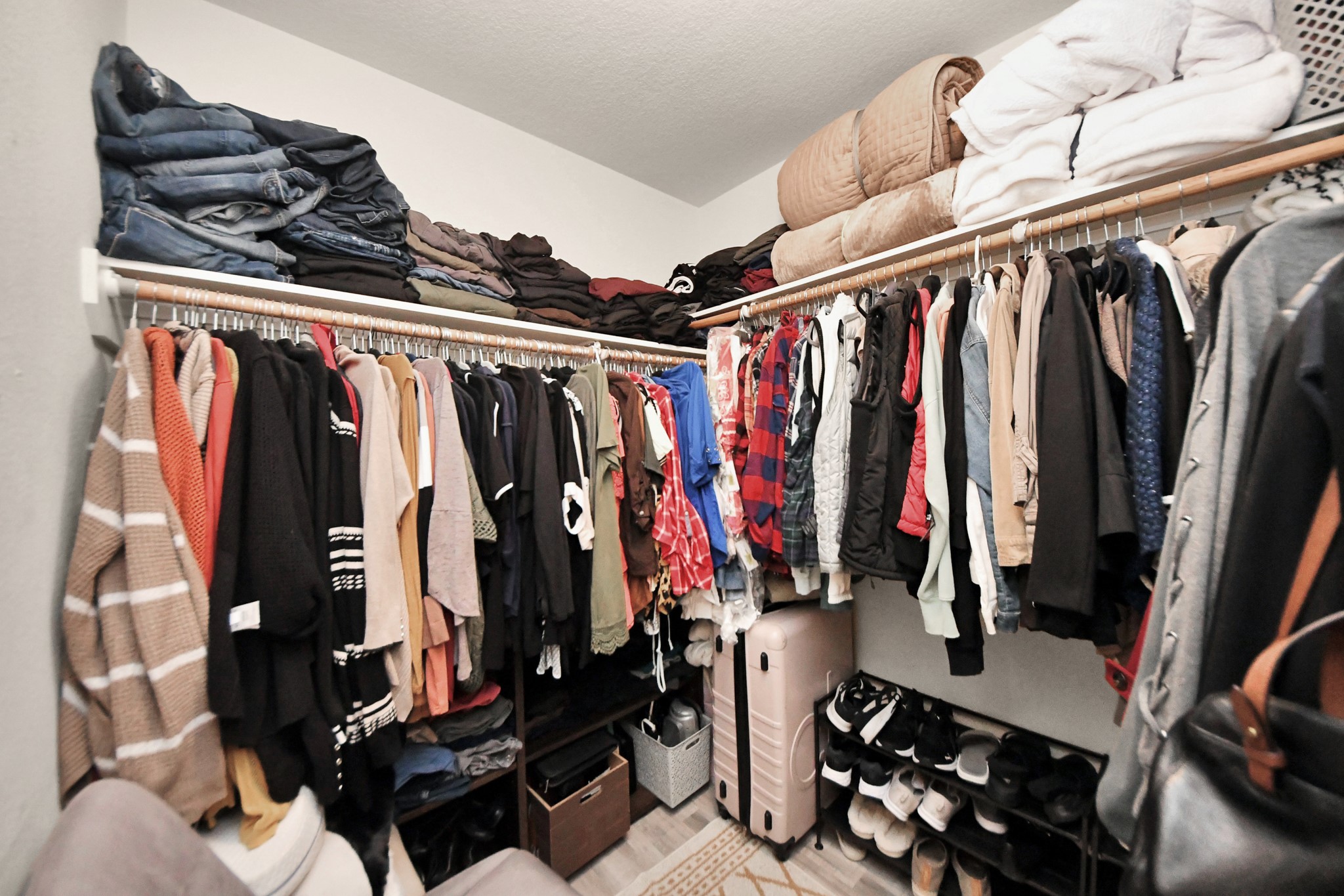 28961 San Bernard River Loop Spring, TX 77386 - Photo 25 of 36 a view of walk in closet with clothes and shoes