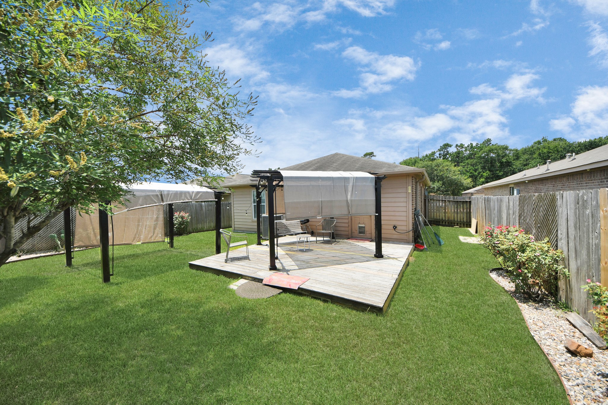 28961 San Bernard River Loop Spring, TX 77386 - Photo 31 of 36 a view of a house with backyard and sitting area