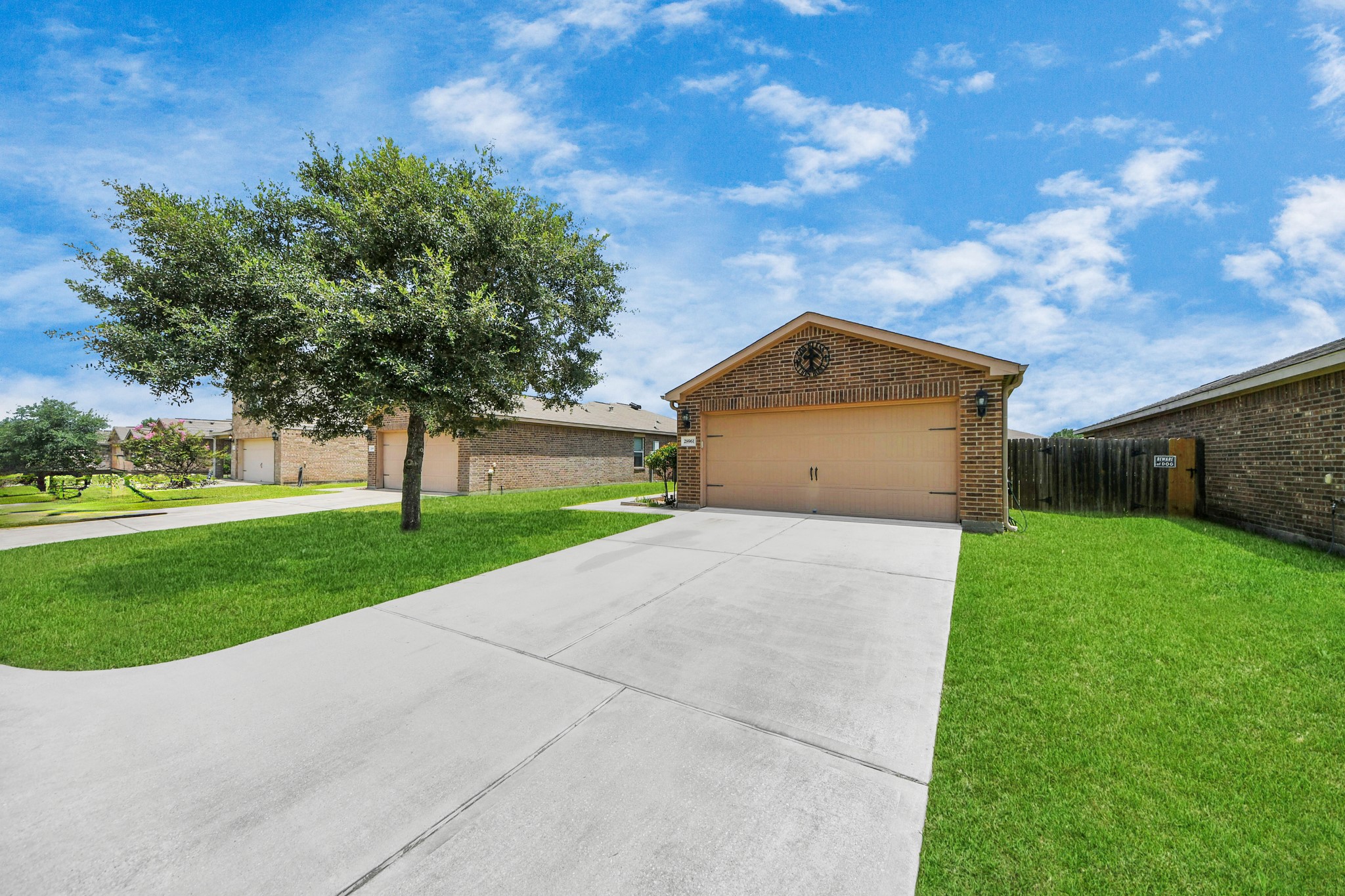 28961 San Bernard River Loop Spring, TX 77386 - Photo 7 of 36 a front view of a house with a yard and a garage