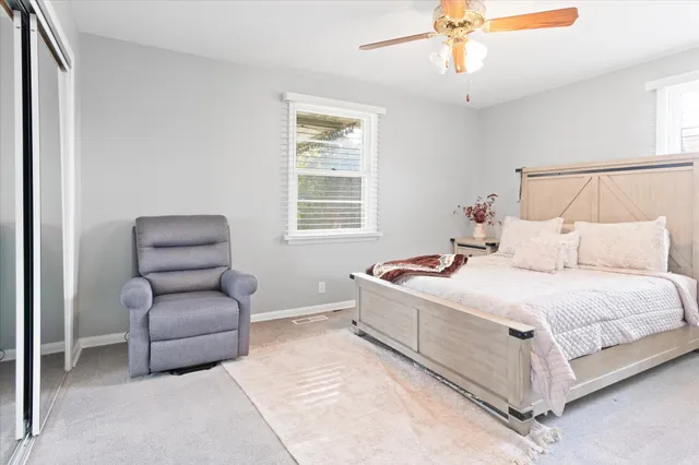 a bedroom with a bed and a couch