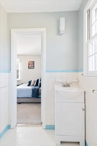 a bedroom with furniture and a window