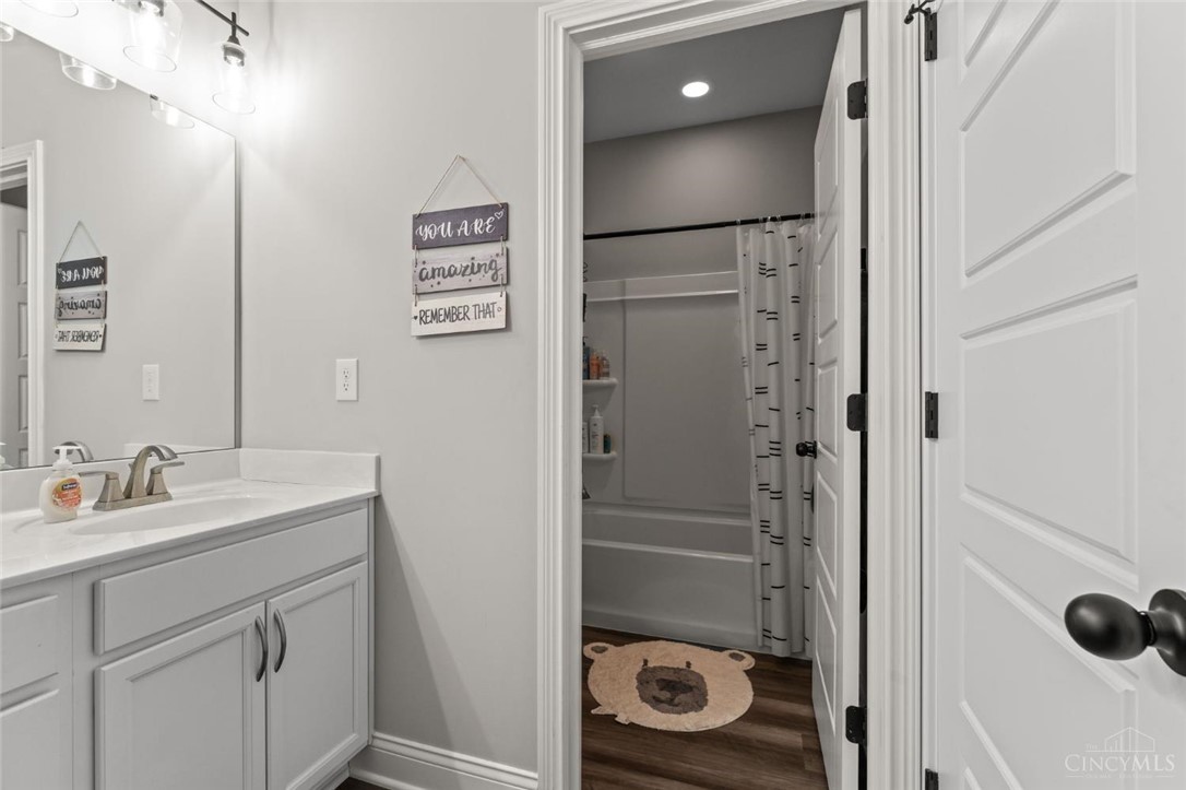 2425 Middleboro Road Clarksville, OH 45113 - Photo 82 of 91 This bright bathroom features a vanity with a white countertop and a convenient shower.