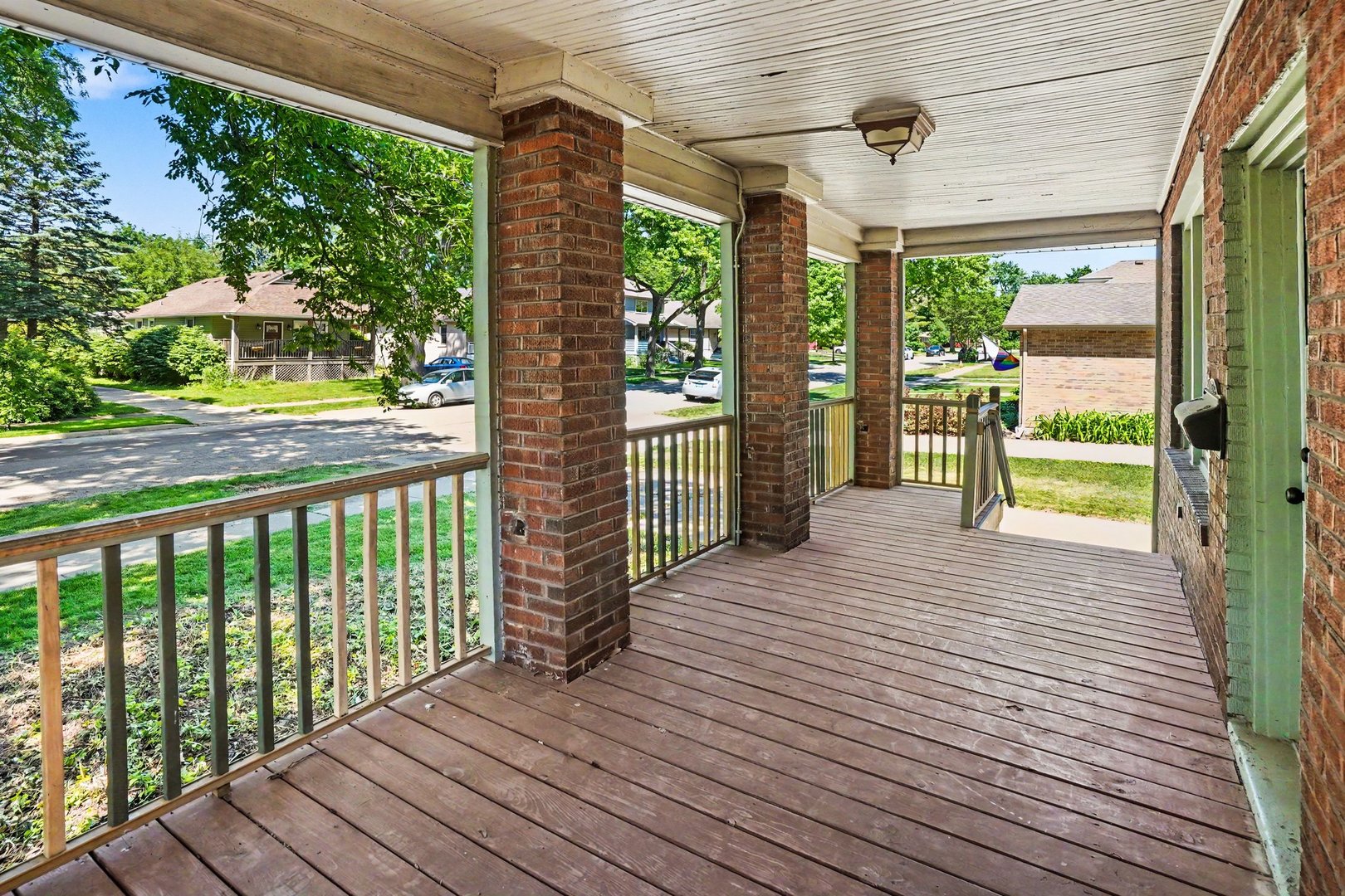 1661 Burr Oak Road Homewood, IL 60430 - Photo 2 of 17 a view of a porch with wooden floor