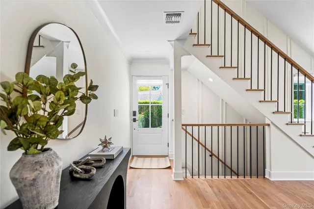 a view of entryway with wooden floor
