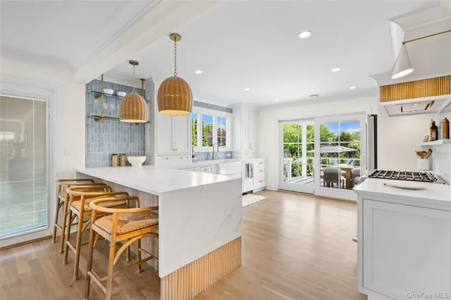 a large kitchen with a table and chairs in it