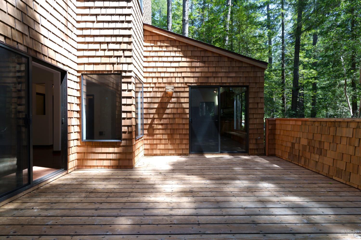 355 Chinquapin Lane The Sea Ranch, CA 95497 - Photo 12 of 31 a view of a porch with wooden floor and stairs