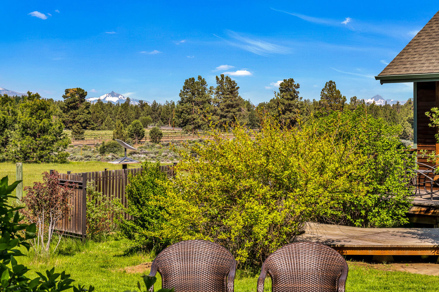 19007 Innes Market Road Bend, OR 97703 - Photo 30 of 39 a view of a yard with plants and a bench