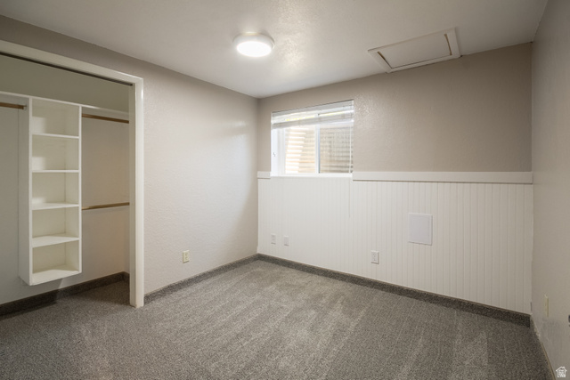 634 South 2100th Street West Vernal, UT 84078 - Photo 38 of 71 Room with gray carpet, beadboard wainscoting, and a window with blinds