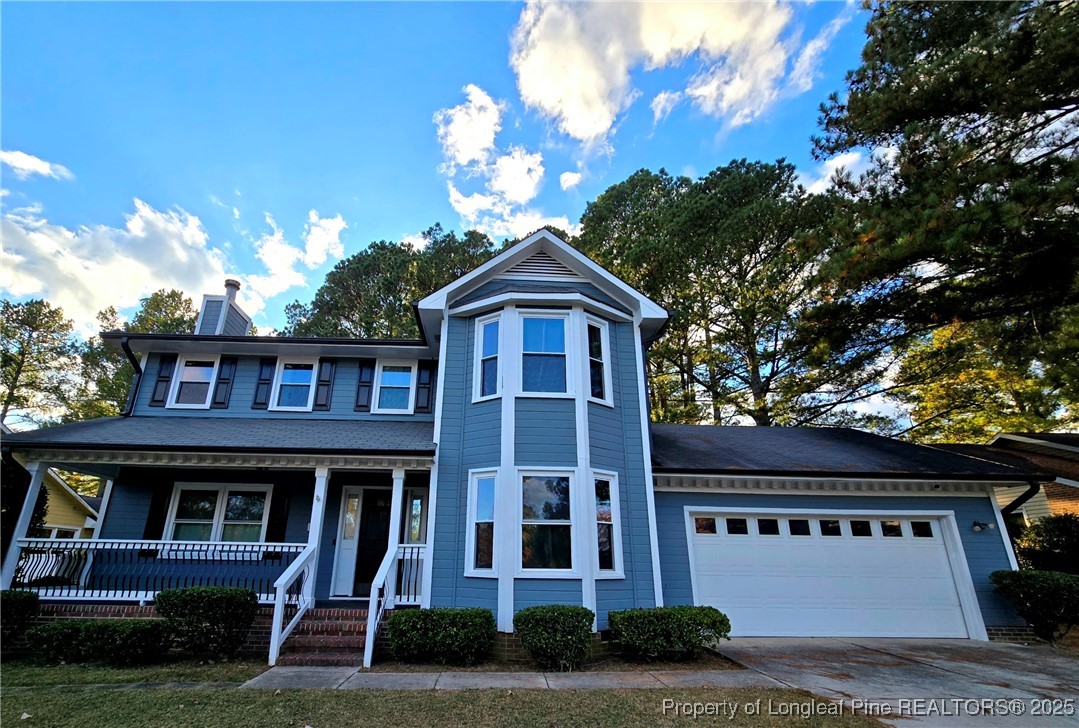 a view of a brick house with large windows