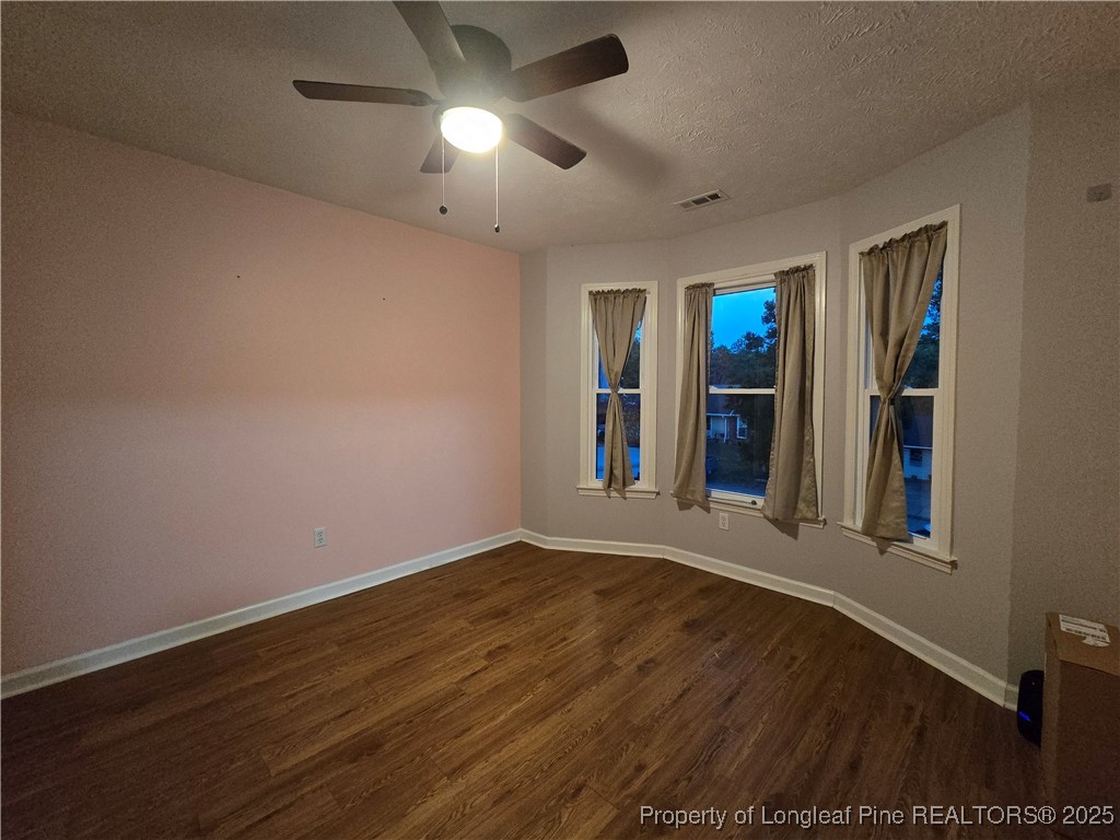 944 Flintwood Road Fayetteville, NC 28314 - Photo 16 of 24 an empty room with wooden floor and windows