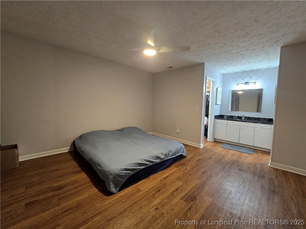 944 Flintwood Road Fayetteville, NC 28314 - Photo 20 of 24 a living room with a bed furniture and kitchen view