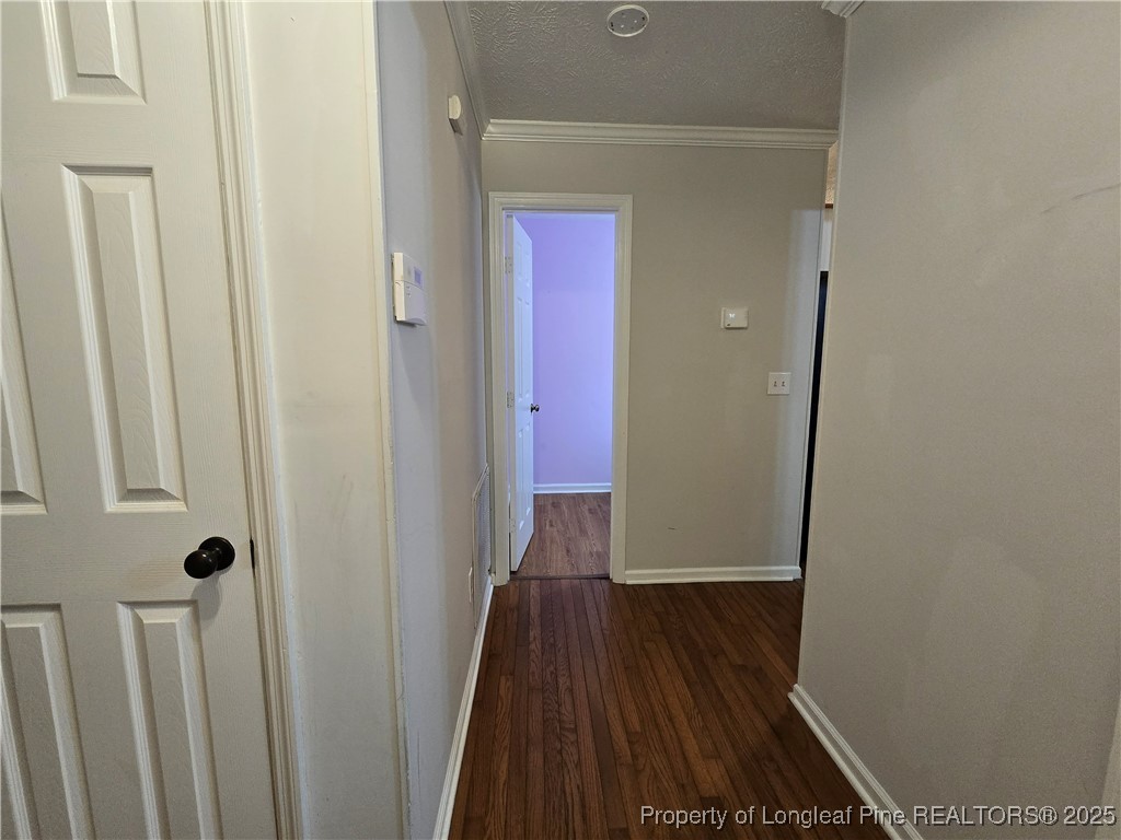944 Flintwood Road Fayetteville, NC 28314 - Photo 5 of 24 a view of a hallway with wooden floor