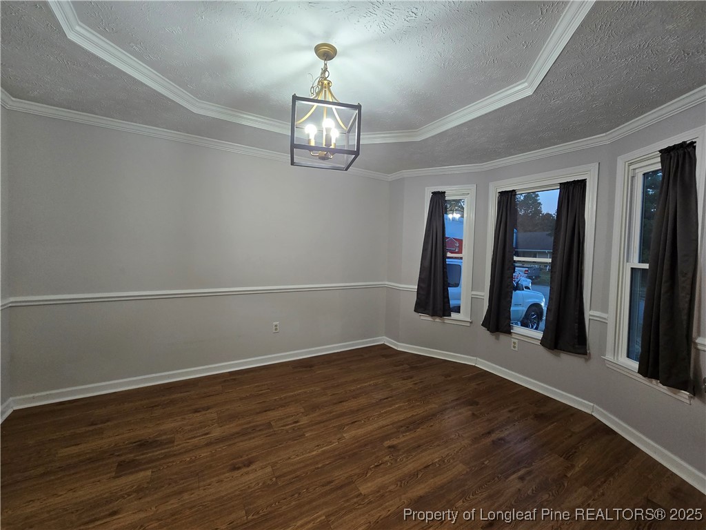 944 Flintwood Road Fayetteville, NC 28314 - Photo 6 of 24 a view of an empty room with wooden floor
