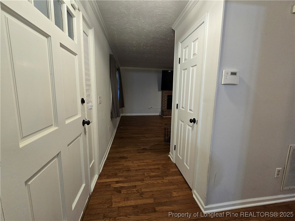944 Flintwood Road Fayetteville, NC 28314 - Photo 8 of 24 a view of a hallway with a wooden door