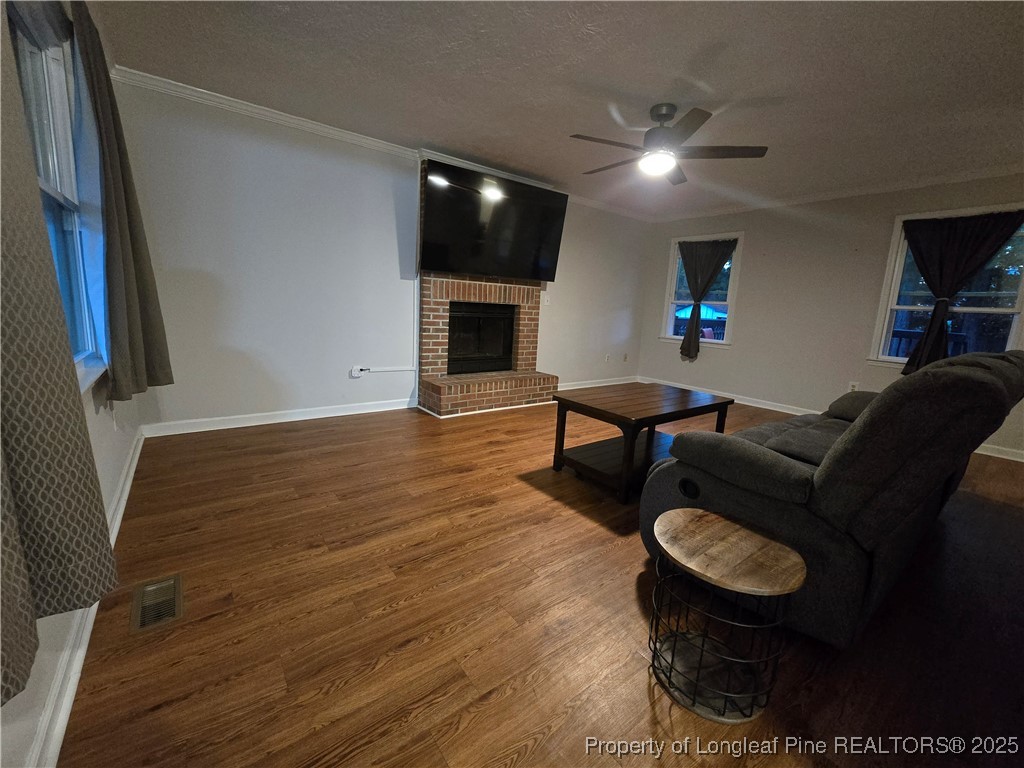 944 Flintwood Road Fayetteville, NC 28314 - Photo 9 of 24 a living room with furniture and a flat screen tv