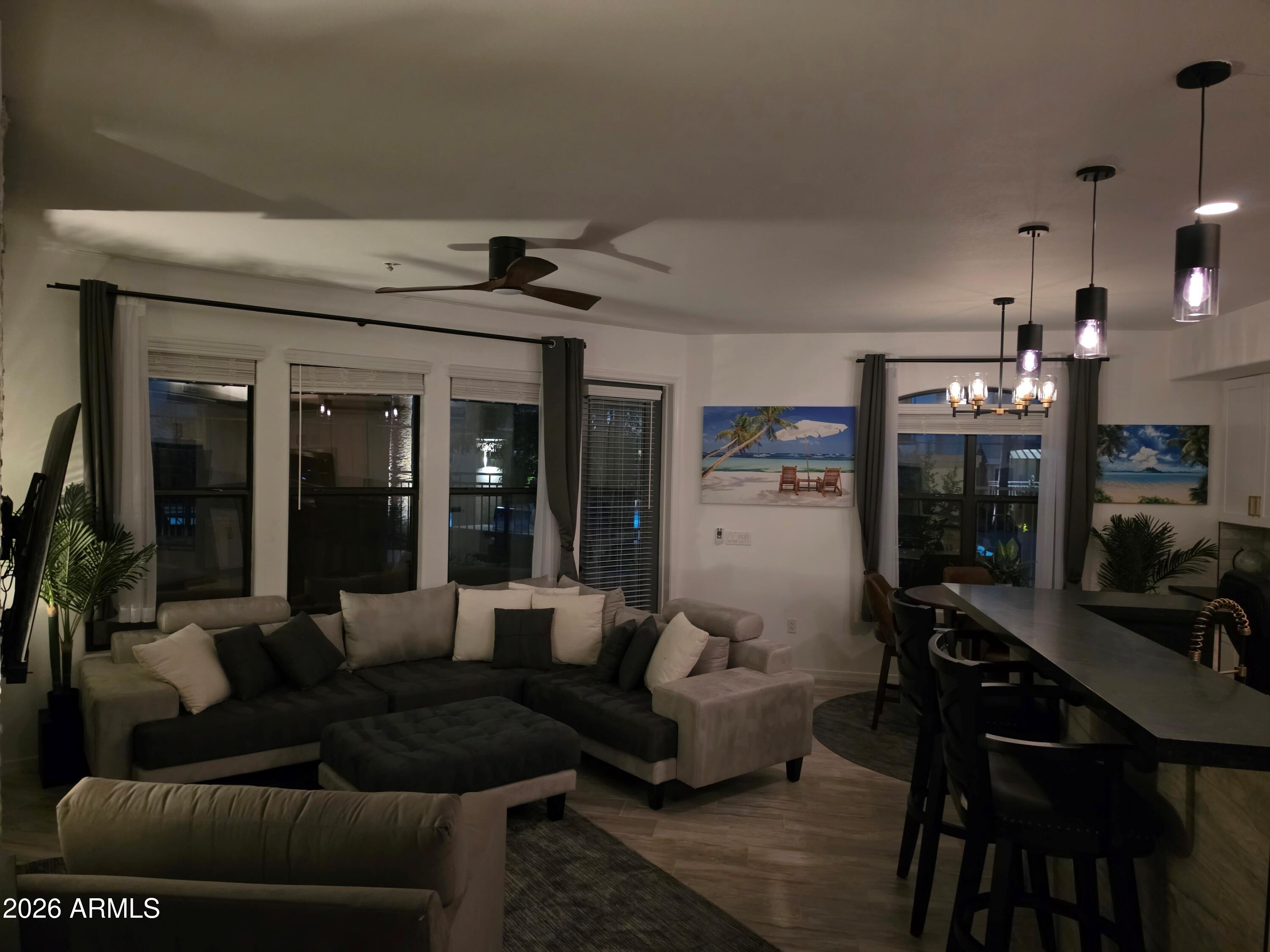 7601 East Indian Bend Road, Unit 1017 Scottsdale, AZ 85250 - Photo 37 of 49 a living room with furniture and a fireplace