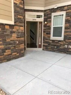 a view of front door of house with stairs