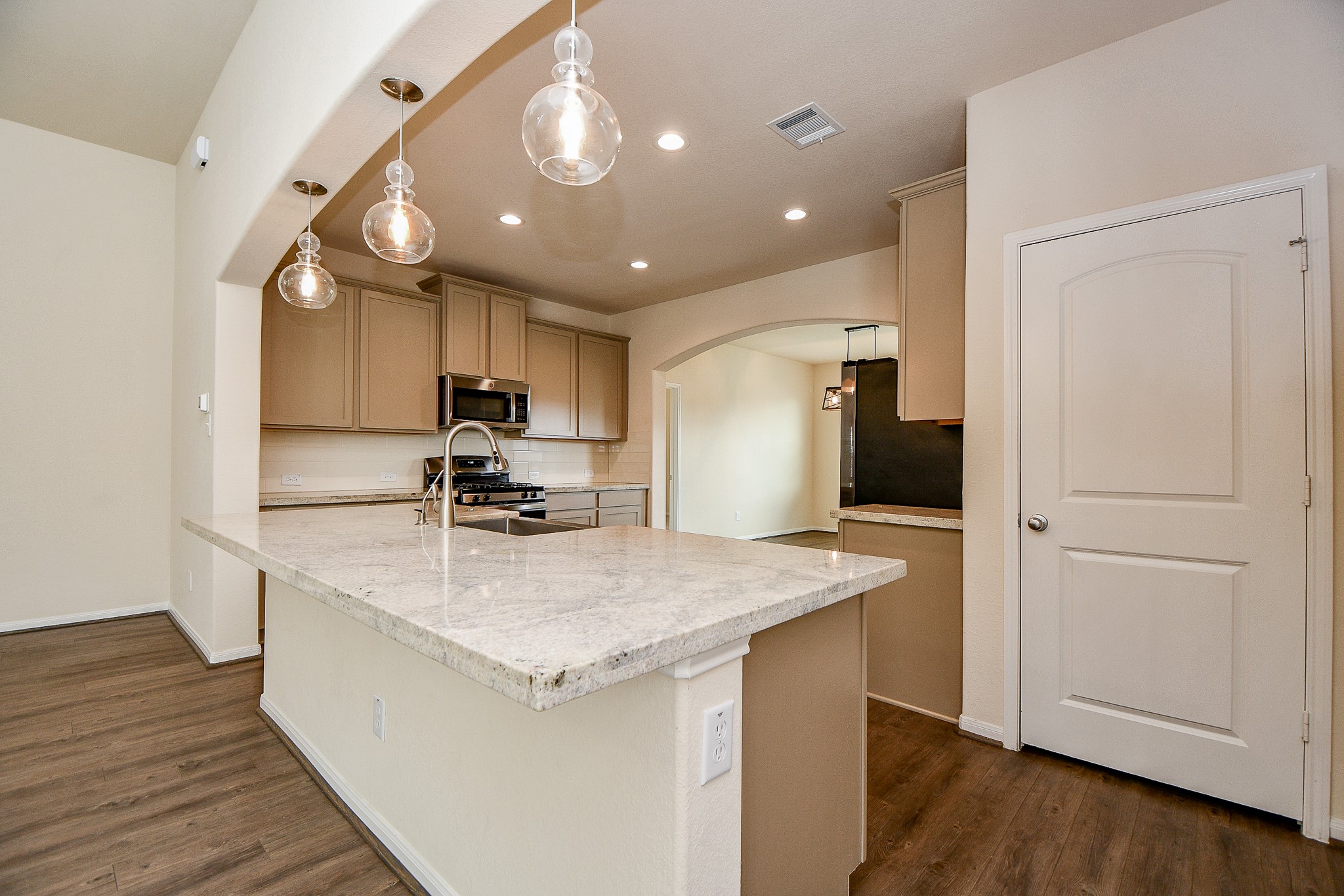 15210 Ordie Run Drive Humble, TX 77346 - Photo 11 of 40 a kitchen with a sink appliances and cabinets
